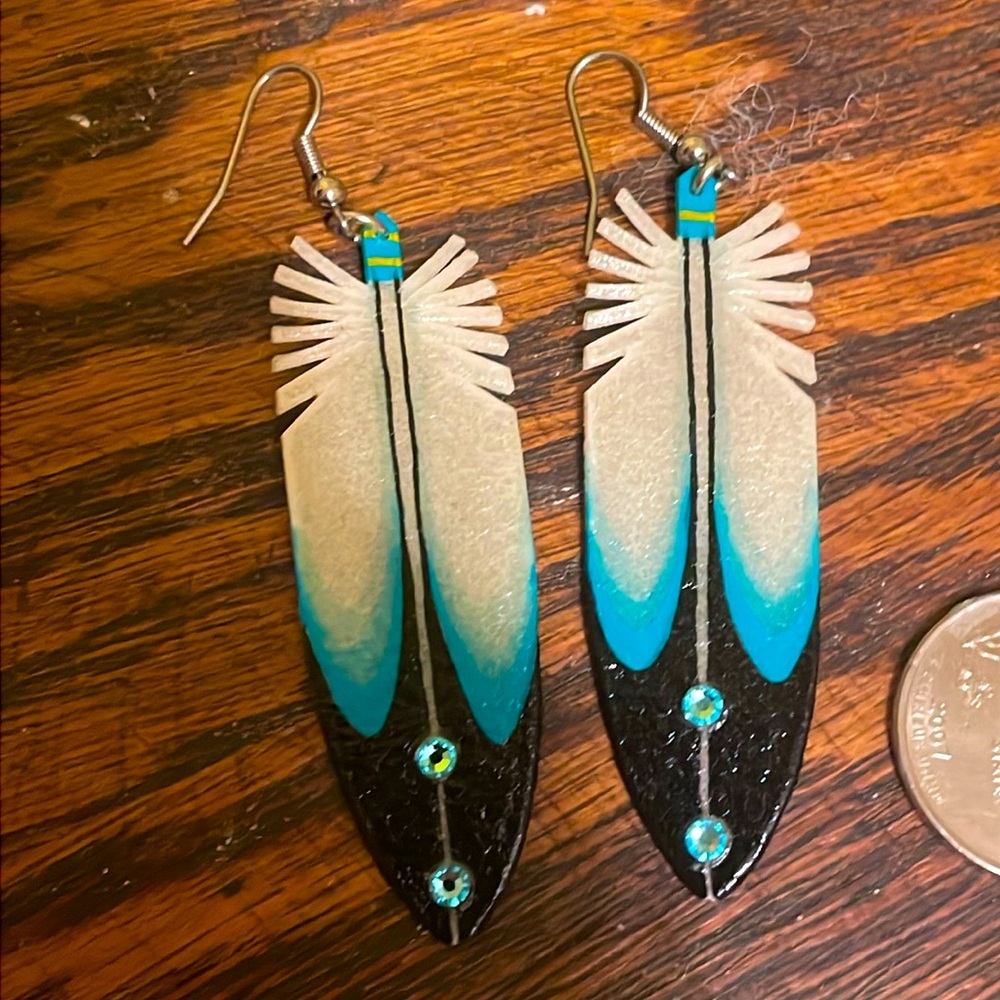 Feather earrings made from rawhide purchased in New Mexico